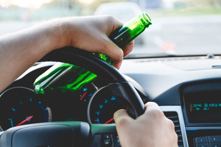 driving with beer bottle in hand